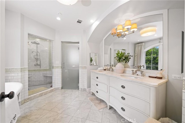 325 W Bellevue Dr, Pasadena, CA 91105 - full bathroom with a shower stall, double vanity, a chandelier, a soaking tub, and recessed lighting