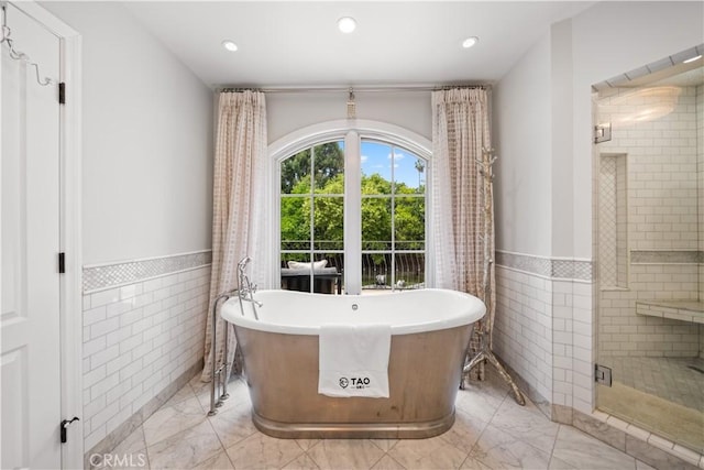 325 W Bellevue Dr, Pasadena, CA 91105 - full bath with tile walls, a shower stall, marble finish floors, a wainscoted wall, and a freestanding bath