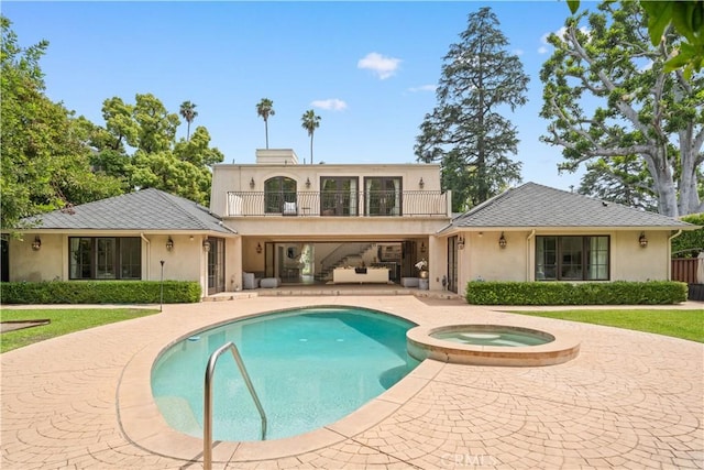 325 W Bellevue Dr, Pasadena, CA 91105 - rear view of property with a balcony, stucco siding, a patio, and a pool with connected hot tub
