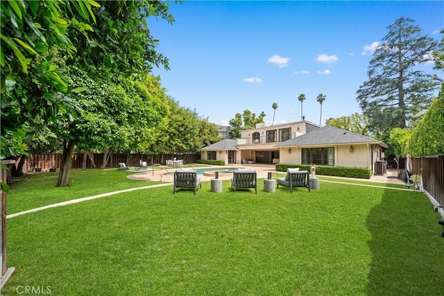 325 W Bellevue Dr, Pasadena, CA 91105 - back of property featuring stucco siding, a fenced backyard, and a patio area