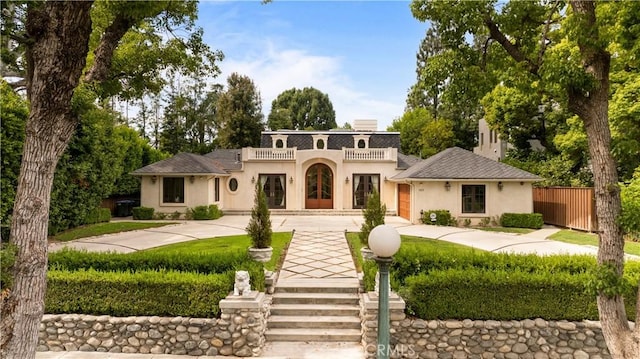325 W Bellevue Dr, Pasadena, CA 91105 - mediterranean / spanish-style house featuring stucco siding, curved driveway, and french doors