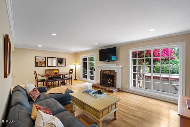 5489 N Bryn Mawr St, Ventura, CA 93003 - living room featuring crown molding, light wood-style flooring, recessed lighting, and a fireplace