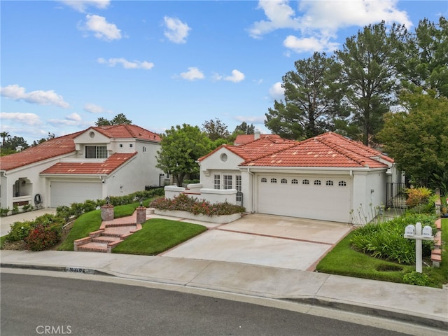 26320 Ivrea Pl, Valencia, CA 91355 - mediterranean / spanish-style house with a tile roof, a garage, stucco siding, driveway, and a chimney