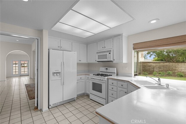 26320 Ivrea Pl, Valencia, CA 91355 - kitchen featuring white appliances, a sink, plenty of natural light, white cabinetry, and recessed lighting