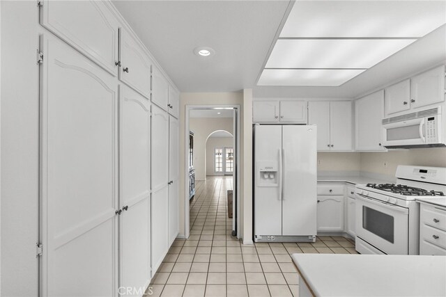26320 Ivrea Pl, Valencia, CA 91355 - kitchen featuring white appliances, white cabinetry, light tile patterned flooring, and recessed lighting