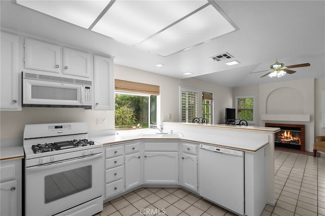 26320 Ivrea Pl, Valencia, CA 91355 - kitchen featuring white appliances, a sink, open floor plan, white cabinetry, and a peninsula