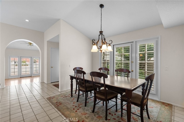 26320 Ivrea Pl, Valencia, CA 91355 - dining area featuring healthy amount of natural light, arched walkways, a chandelier, baseboards, and lofted ceiling