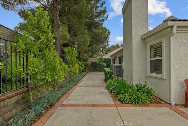 26320 Ivrea Pl, Valencia, CA 91355 - view of yard featuring central AC unit and a patio