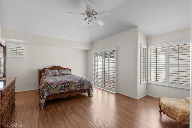 26320 Ivrea Pl, Valencia, CA 91355 - bedroom featuring vaulted ceiling, wood finished floors, baseboards, and ceiling fan