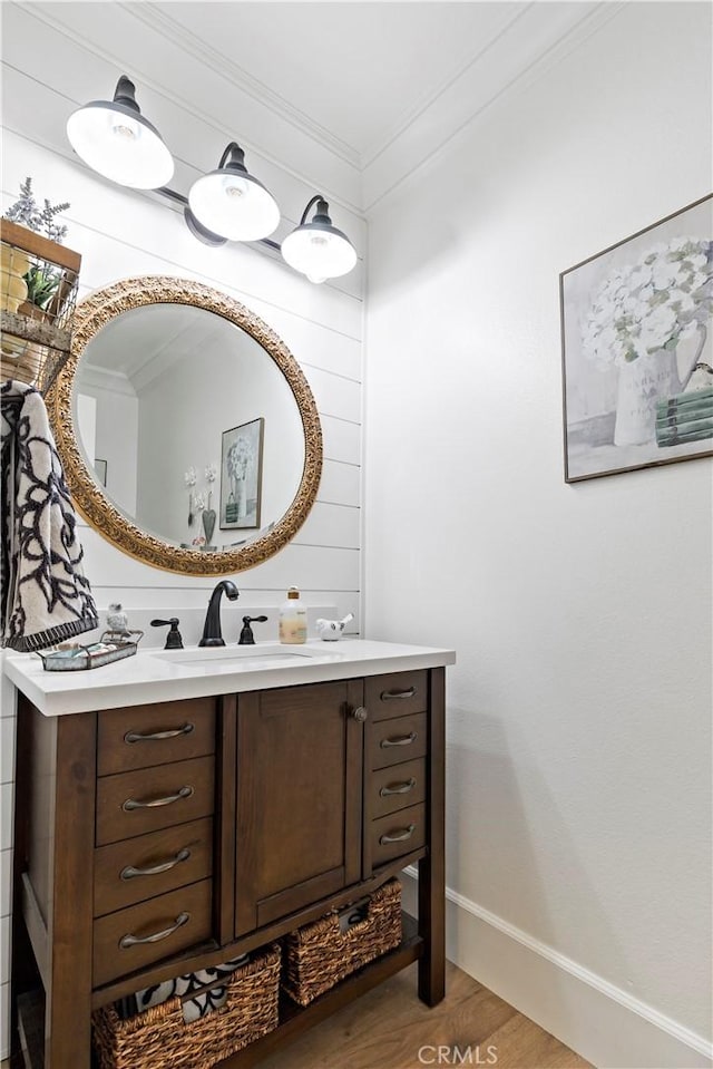 23556 Kathryn St, Murrieta, CA 92562 - bathroom featuring vanity, wood finished floors, baseboards, and crown molding
