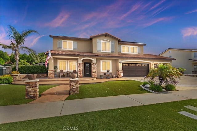 14160 Vai Brothers Dr, Rancho Cucamonga, CA 91739 - mediterranean / spanish-style house with stucco siding, a porch, concrete driveway, stone siding, and a tiled roof