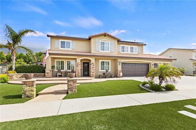 14160 Vai Brothers Dr, Rancho Cucamonga, CA 91739 - mediterranean / spanish-style house with stucco siding, driveway, a tiled roof, and stone siding