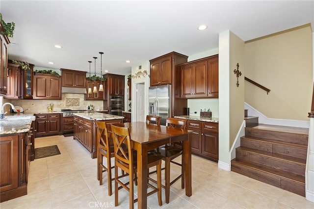 14160 Vai Brothers Dr, Rancho Cucamonga, CA 91739 - kitchen featuring stainless steel appliances, light tile patterned floors, a sink, tasteful backsplash, and recessed lighting