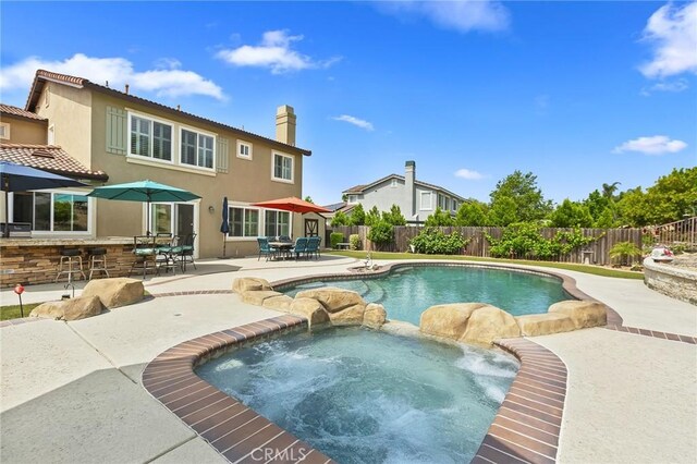 14160 Vai Brothers Dr, Rancho Cucamonga, CA 91739 - view of pool featuring a fenced backyard, a patio, outdoor dining area, and a pool with connected hot tub