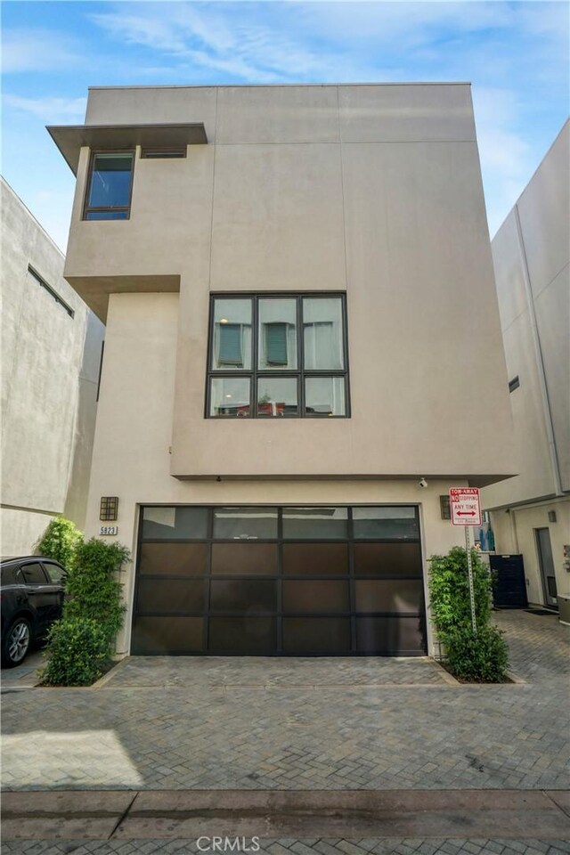 5823 Seahorse Ct, Playa Vista, CA 90094 - view of front of home with a garage, decorative driveway, and stucco siding
