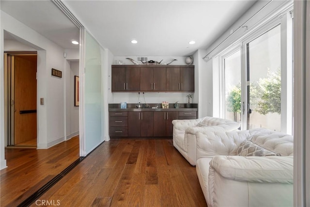 5823 Seahorse Ct, Playa Vista, CA 90094 - kitchen with dark wood-style flooring, recessed lighting, dark brown cabinetry, and open floor plan