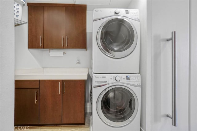 5823 Seahorse Ct, Playa Vista, CA 90094 - laundry room with stacked washing machine and dryer and cabinet space