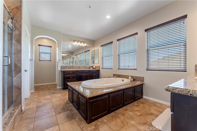 12178 Scenic Vw, Riverside, CA 92505 - bathroom with a stall shower, a bath, baseboards, and vanity