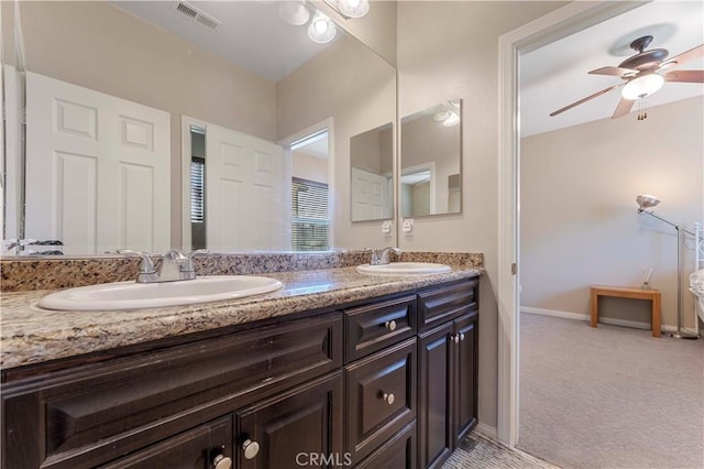 12178 Scenic Vw, Riverside, CA 92505 - bathroom with double vanity, a ceiling fan, and baseboards