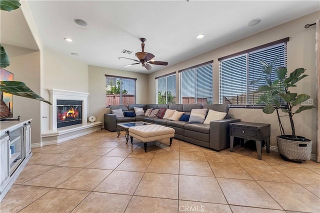 12178 Scenic Vw, Riverside, CA 92505 - living room with ceiling fan, light tile patterned floors, a glass covered fireplace, baseboards, and recessed lighting