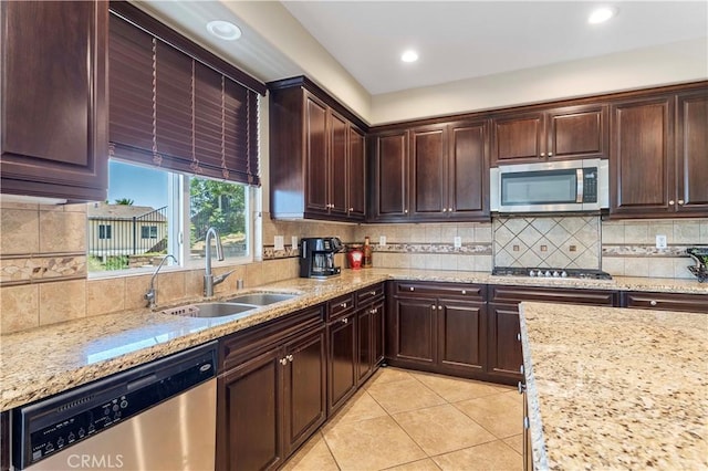 12178 Scenic Vw, Riverside, CA 92505 - kitchen with appliances with stainless steel finishes, light tile patterned floors, a sink, tasteful backsplash, and light stone counters