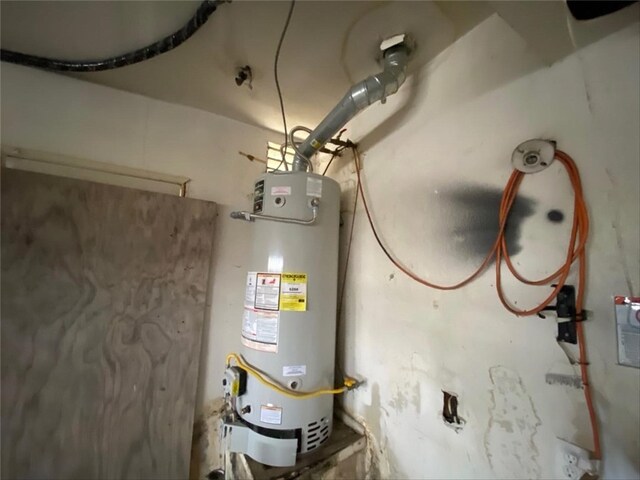 9602 Ives St, Bellflower, CA 90706 - utility room with secured water heater