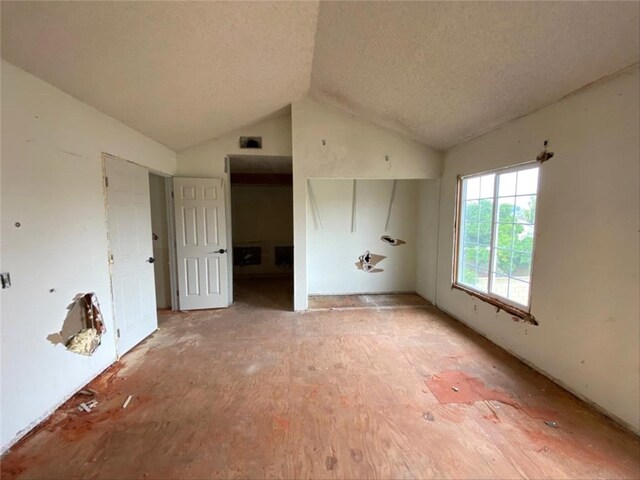 9602 Ives St, Bellflower, CA 90706 - unfurnished bedroom featuring lofted ceiling and a textured ceiling