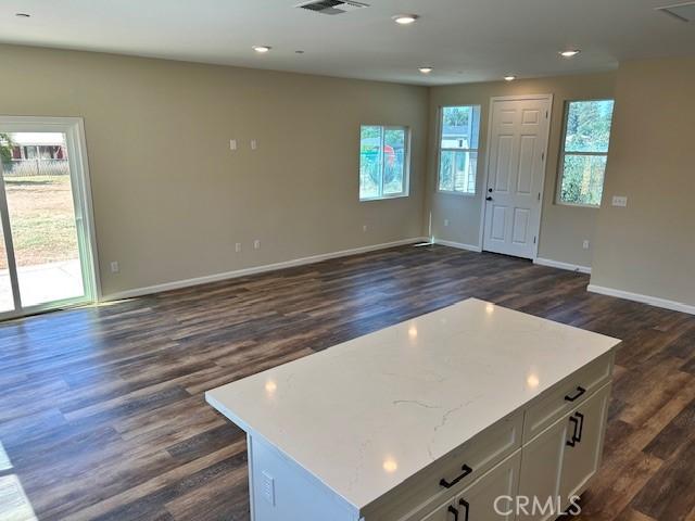 1488 Bille Rd, Paradise, CA 95969 - unfurnished living room with dark wood-style floors and recessed lighting