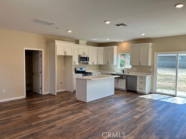 1488 Bille Rd, Paradise, CA 95969 - kitchen with appliances with stainless steel finishes, dark wood-style flooring, white cabinets, recessed lighting, and light countertops