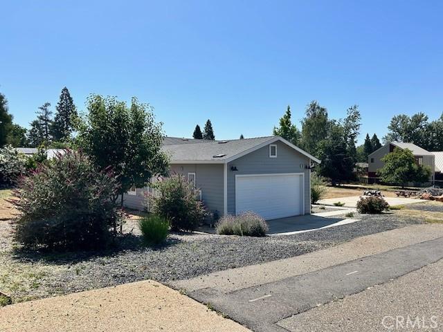 1488 Bille Rd, Paradise, CA 95969 - view of front of property featuring a garage and concrete driveway