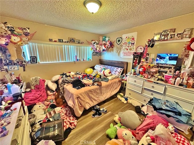 7534 Layton St, Rancho Cucamonga, CA 91730 - bedroom with wood finished floors and a textured ceiling