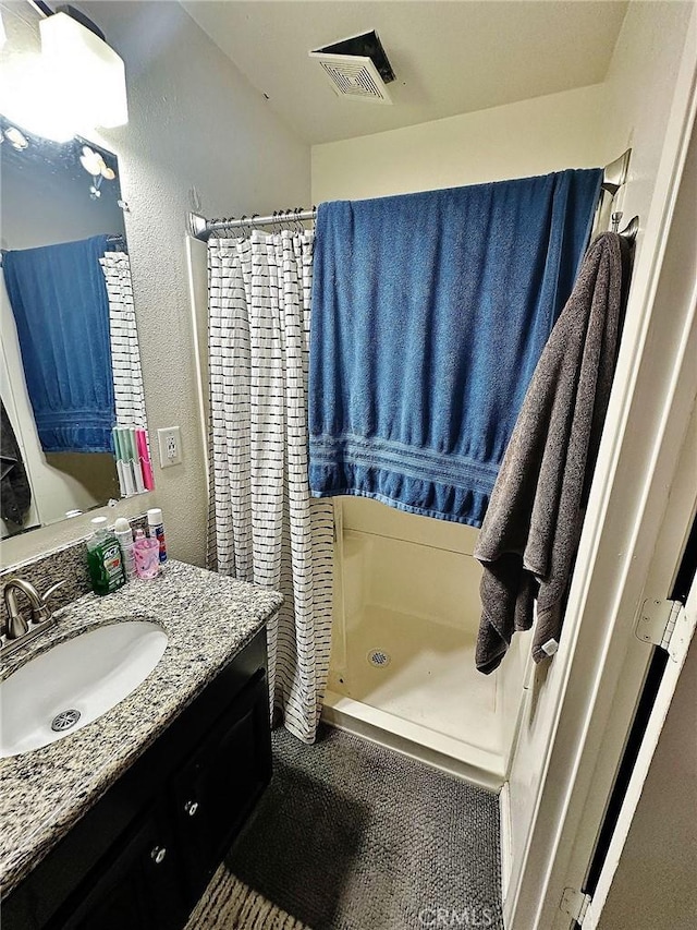 7534 Layton St, Rancho Cucamonga, CA 91730 - full bath featuring vanity, a textured wall, and curtained shower