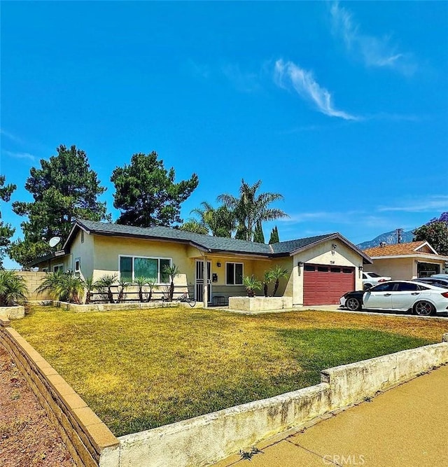 7534 Layton St, Rancho Cucamonga, CA 91730 - ranch-style home with an attached garage, stucco siding, and a front yard