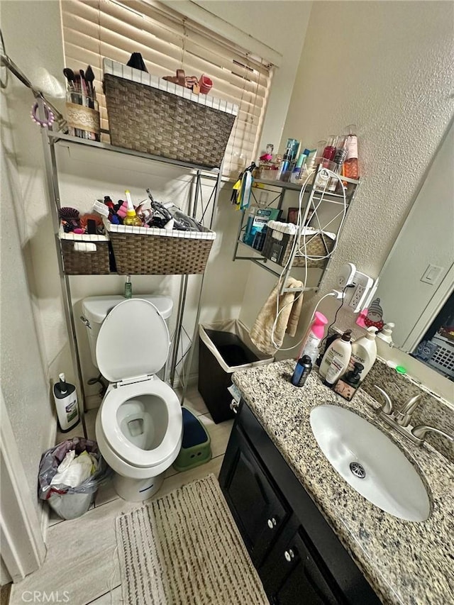 7534 Layton St, Rancho Cucamonga, CA 91730 - bathroom with vanity, toilet, and a textured wall