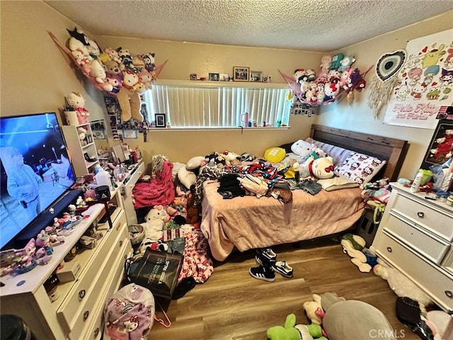 7534 Layton St, Rancho Cucamonga, CA 91730 - bedroom featuring wood finished floors and a textured ceiling