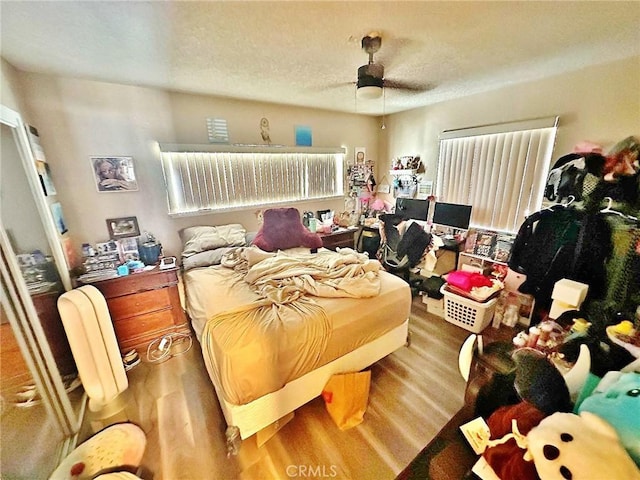 7534 Layton St, Rancho Cucamonga, CA 91730 - bedroom featuring wood finished floors, a textured ceiling, and ceiling fan