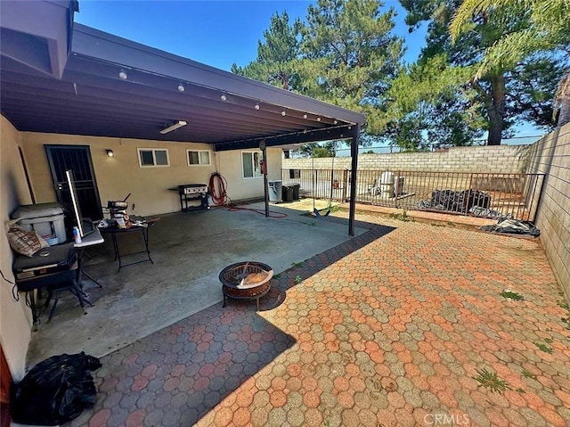 7534 Layton St, Rancho Cucamonga, CA 91730 - fenced backyard with a fire pit, a patio, and area for grilling