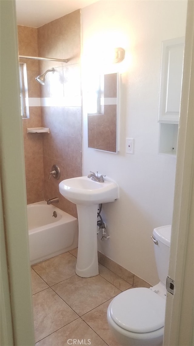 10241 Ruoff Ave, Whittier, CA 90604 - bathroom featuring toilet, tile patterned floors, and washtub / shower combination