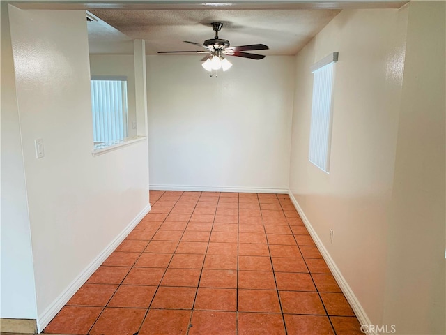 10241 Ruoff Ave, Whittier, CA 90604 - tiled empty room featuring ceiling fan and baseboards