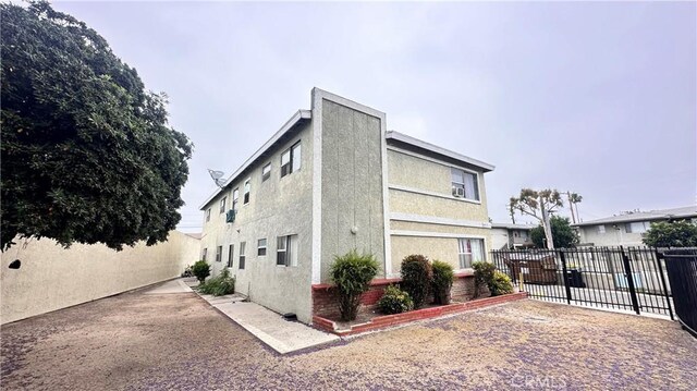 10241 Ruoff Ave, Whittier, CA 90604 - view of home's exterior with stucco siding and a patio area