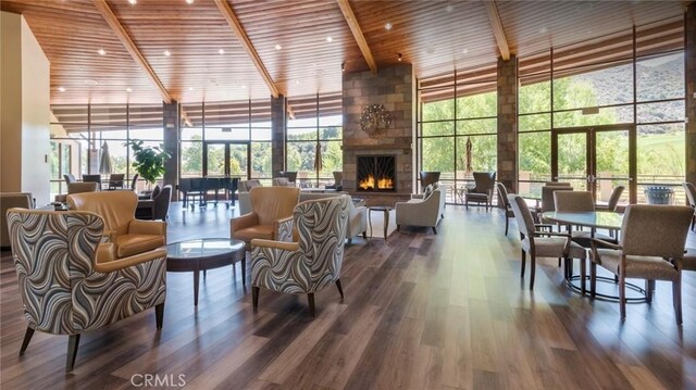 24212 Nobe St, Corona, CA 92883 - lobby with a towering ceiling, a wall of windows, and wooden ceiling with exposed beams