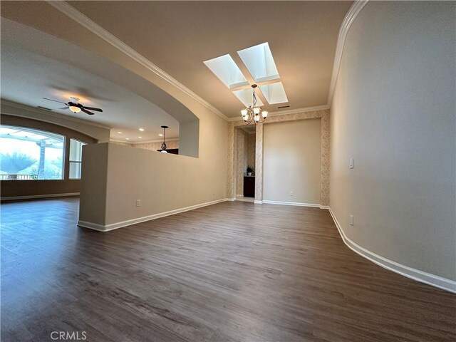24212 Nobe St, Corona, CA 92883 - spare room with crown molding, a skylight, baseboards, dark wood-style floors, and a chandelier