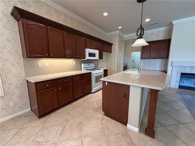 24212 Nobe St, Corona, CA 92883 - kitchen with white appliances, light countertops, crown molding, pendant lighting, and wallpapered walls