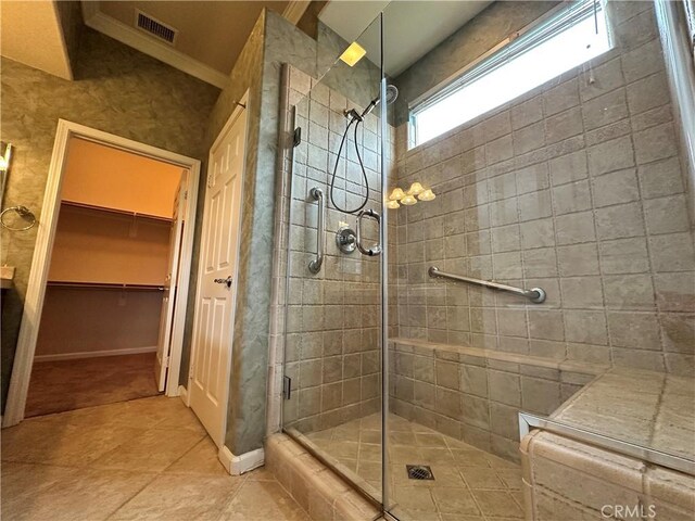 24212 Nobe St, Corona, CA 92883 - bathroom with a shower stall, a walk in closet, and tile patterned floors