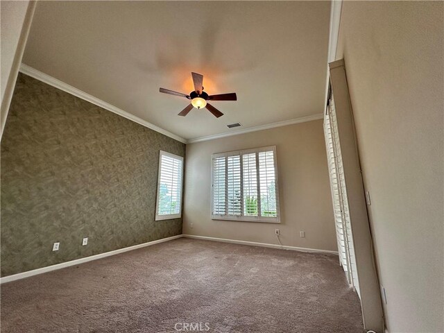 24212 Nobe St, Corona, CA 92883 - empty room with crown molding, a ceiling fan, baseboards, and carpet flooring