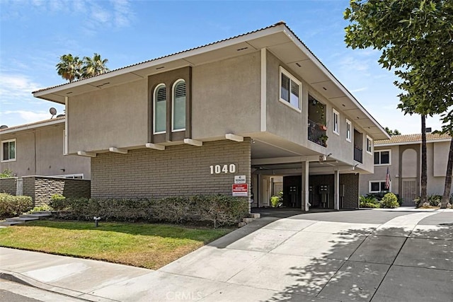 1040 Central Ave Unit 10, Riverside, CA 92507 - view of building exterior with concrete driveway and a carport