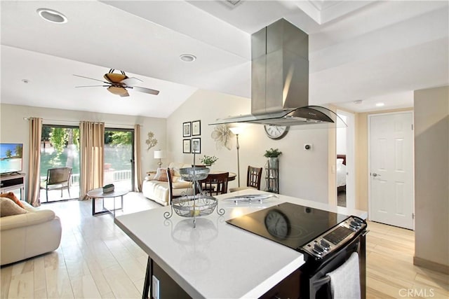 40425 Pebble Beach Cir, Palm Desert, CA 92211 - kitchen with electric range, open floor plan, island range hood, a ceiling fan, and lofted ceiling