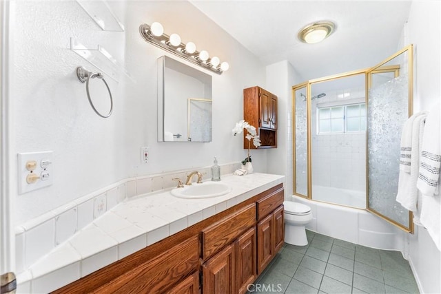 9818 Capulet Ave, Whittier, CA 90603 - full bathroom featuring tile patterned floors, vanity, toilet, and combined bath / shower with glass door