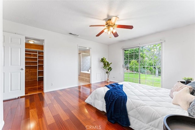 9818 Capulet Ave, Whittier, CA 90603 - bedroom featuring wood finished floors, access to exterior, a spacious closet, baseboards, and connected bathroom