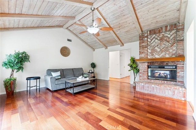 9818 Capulet Ave, Whittier, CA 90603 - living room with wood-type flooring, a ceiling fan, wood ceiling with exposed beams, a fireplace, and high vaulted ceiling
